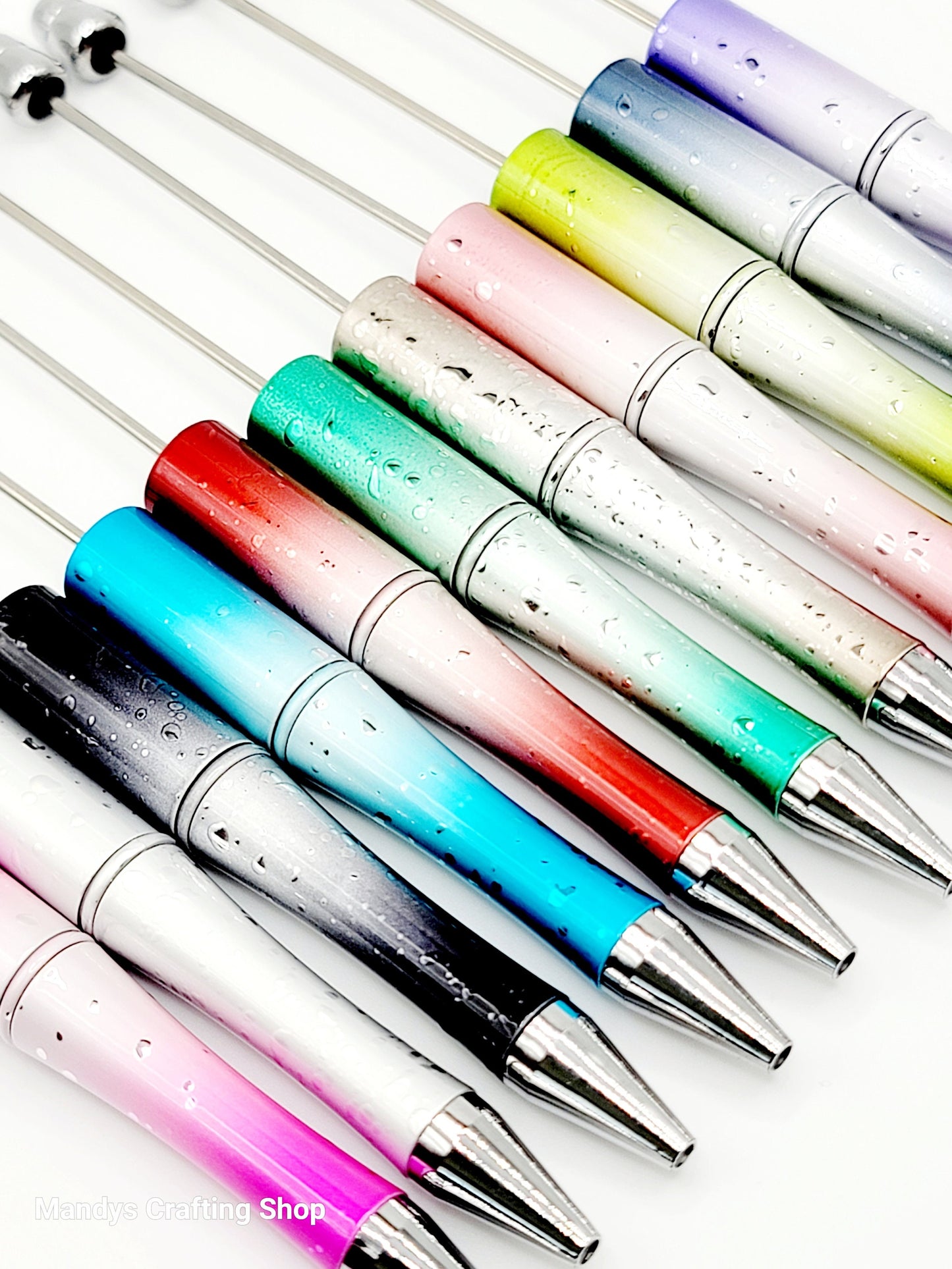 Colorful pens with gradient designs on a white background