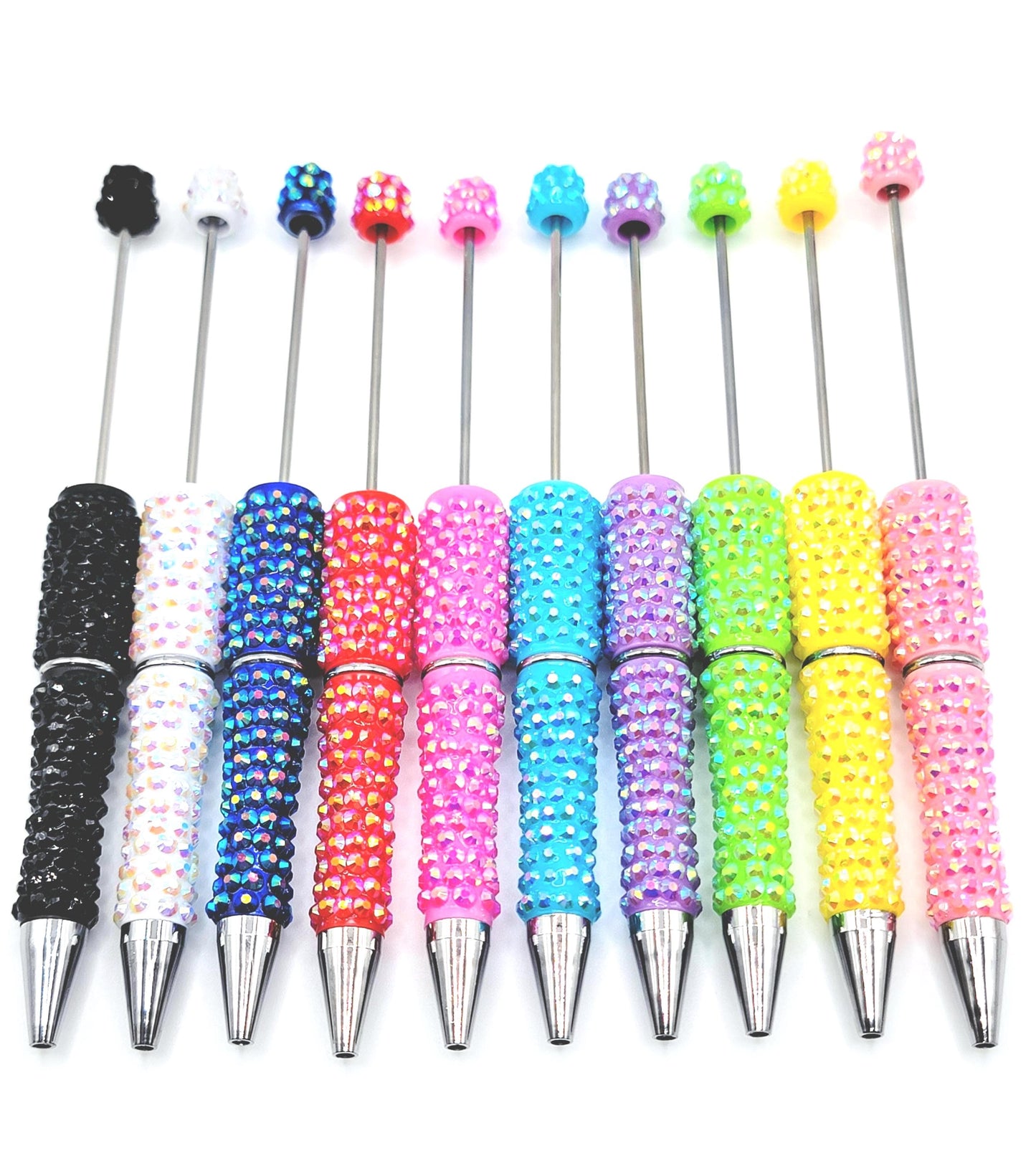 Row of colorful beaded pens with silver accents on a white background