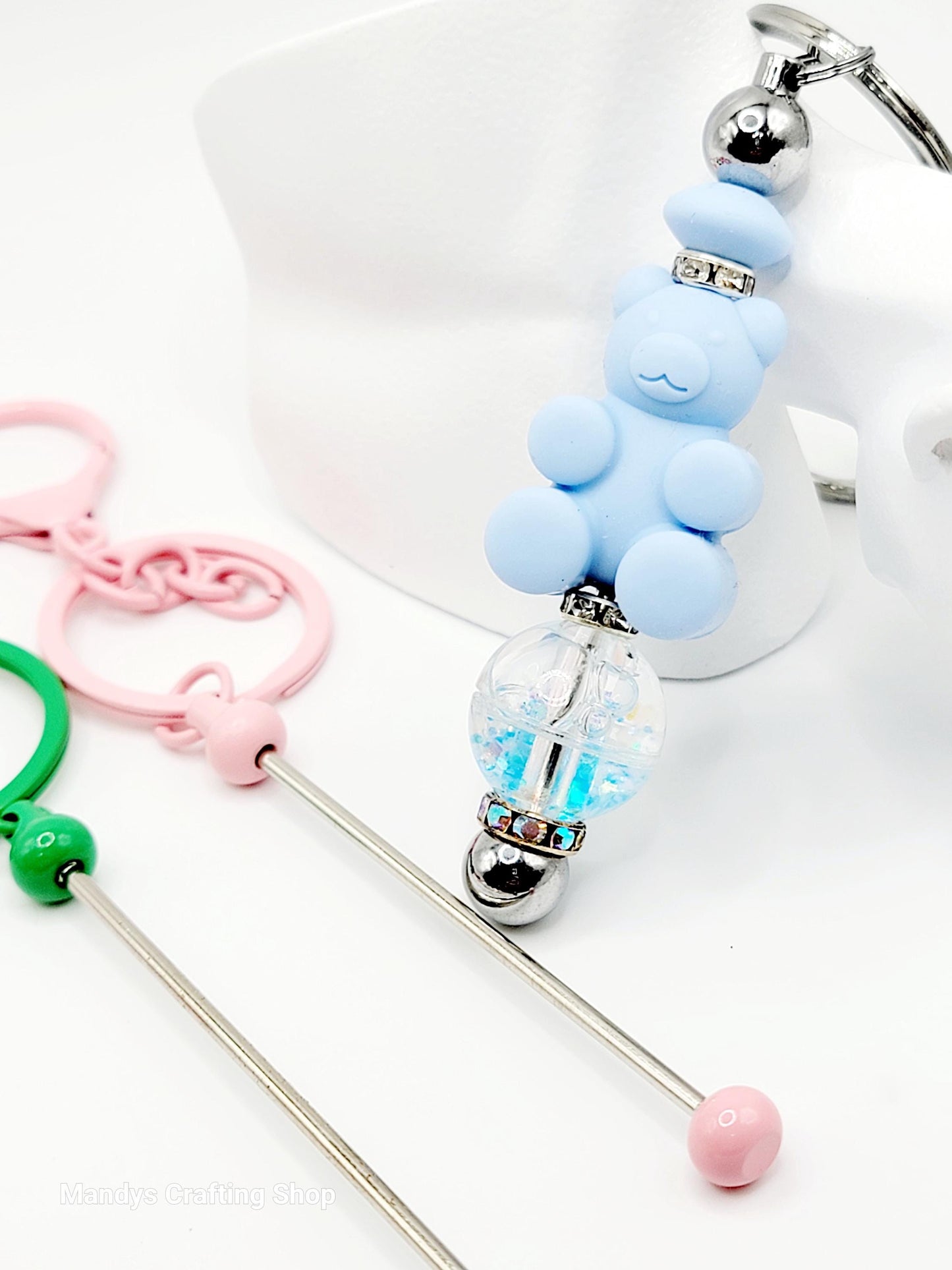 Silicone keychain with bear design and clear ball on a white background