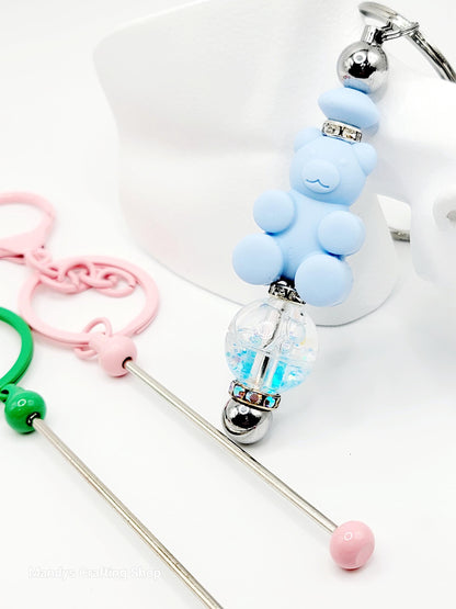 Silicone keychain with bear design and clear ball on a white background