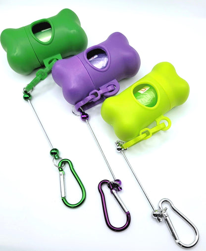 Three colorful dog waste bags dispensers with attached carabiners on a white background