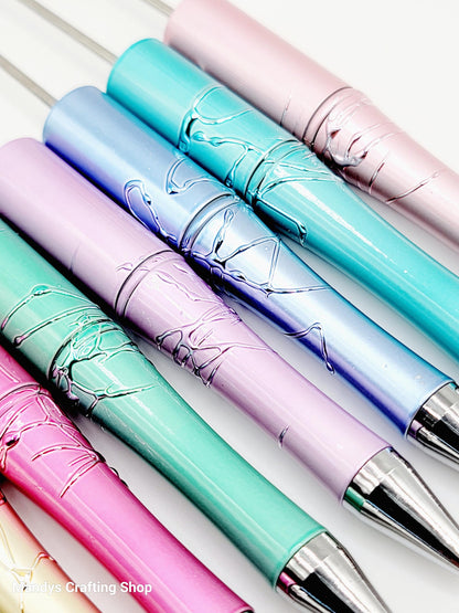 Colorful pens with decorative designs on a white background