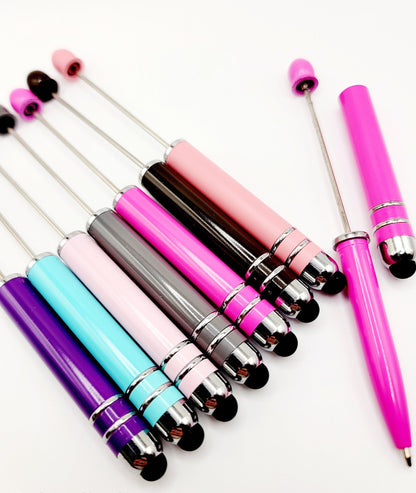 Set of colorful pens with metallic accents on a white background