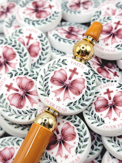 Decorative items with pink bows and gold accents on a white background