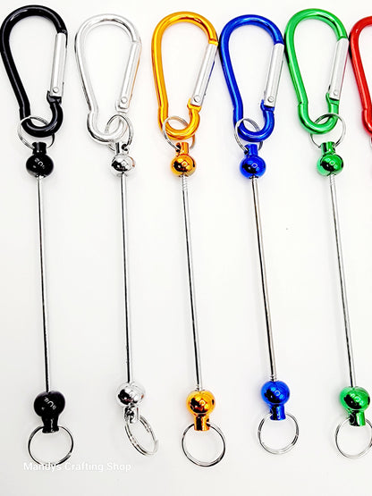 Set of colorful keychain carabiners on white background