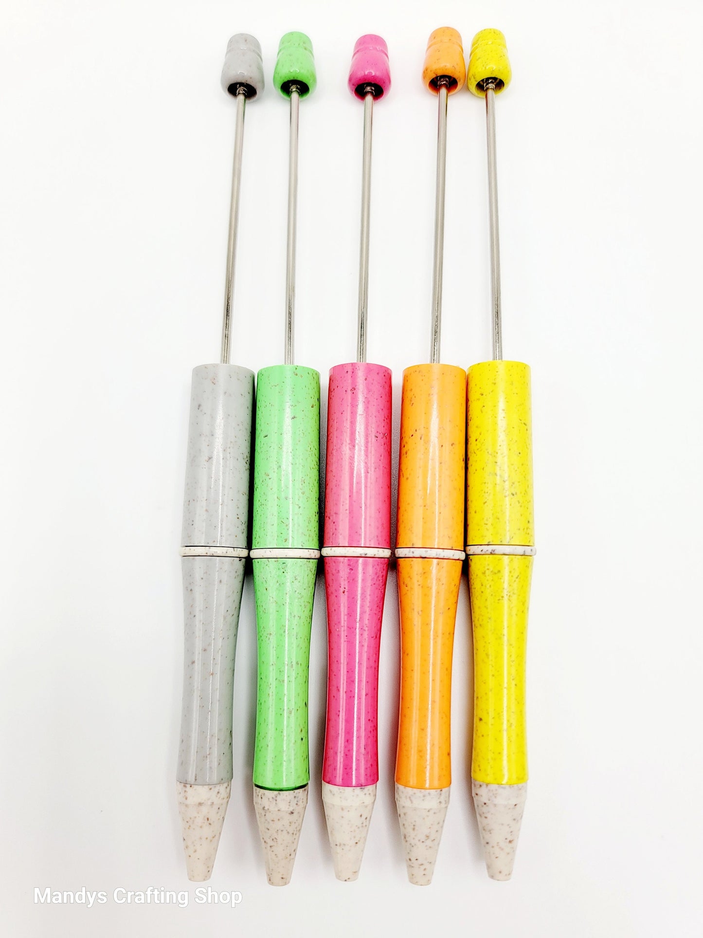 Set of colorful pens with multicolored ends on a white background