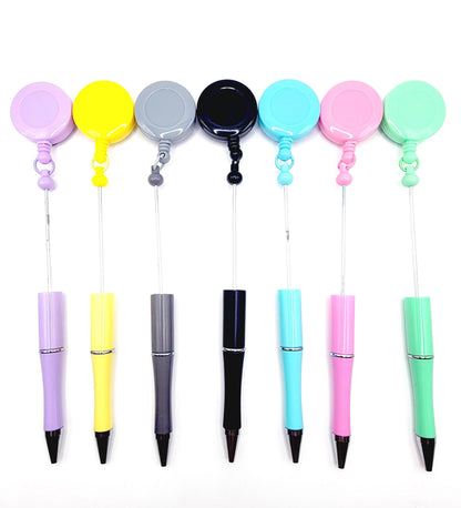 Set of colorful pens with retractable holders on a white background