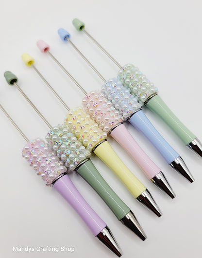 Set of colorful pens with decorative ends on a white background, branded 'Mandys Crafting Shop'.