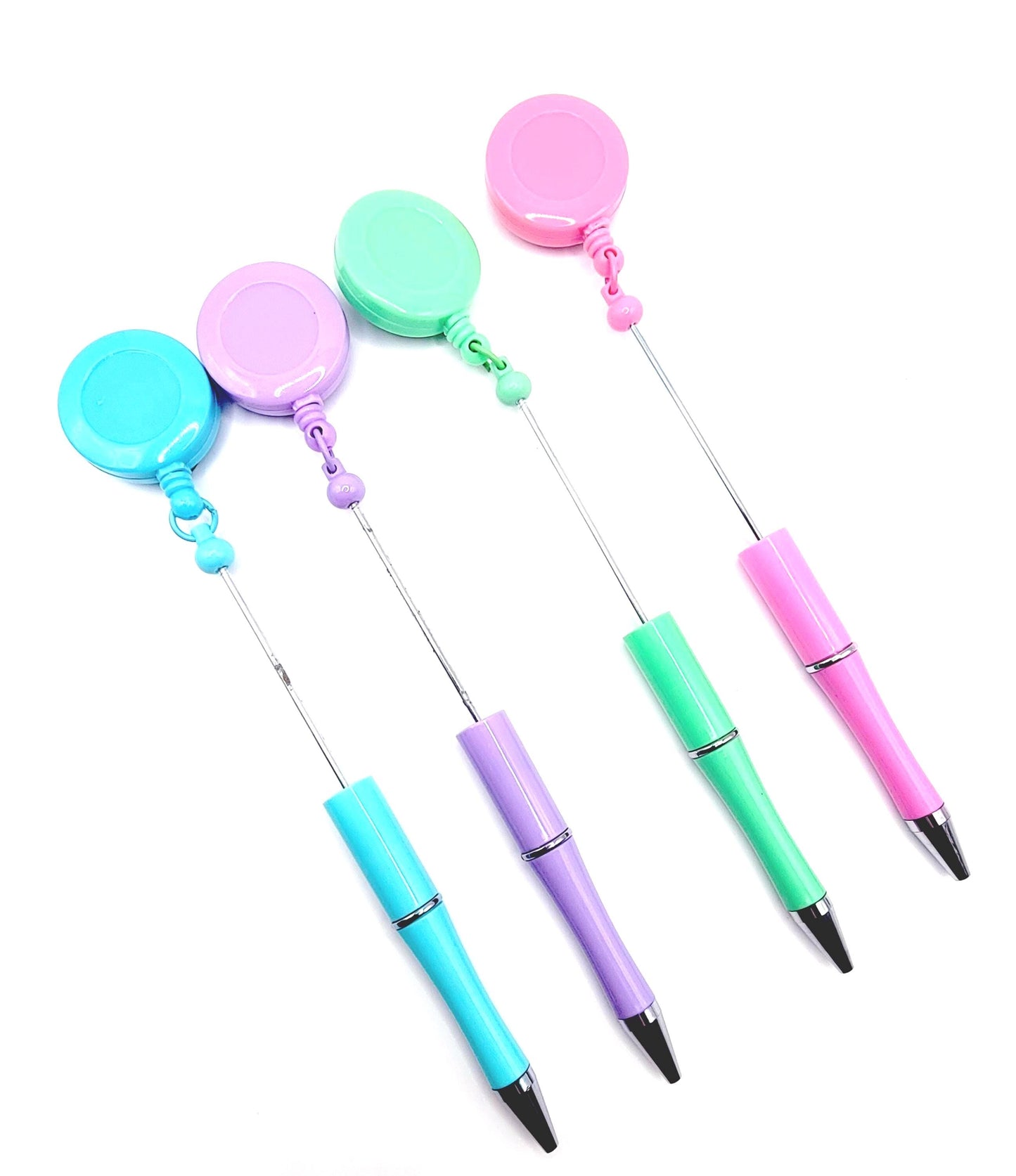 Set of colorful retractable pens with different colored caps on a white background