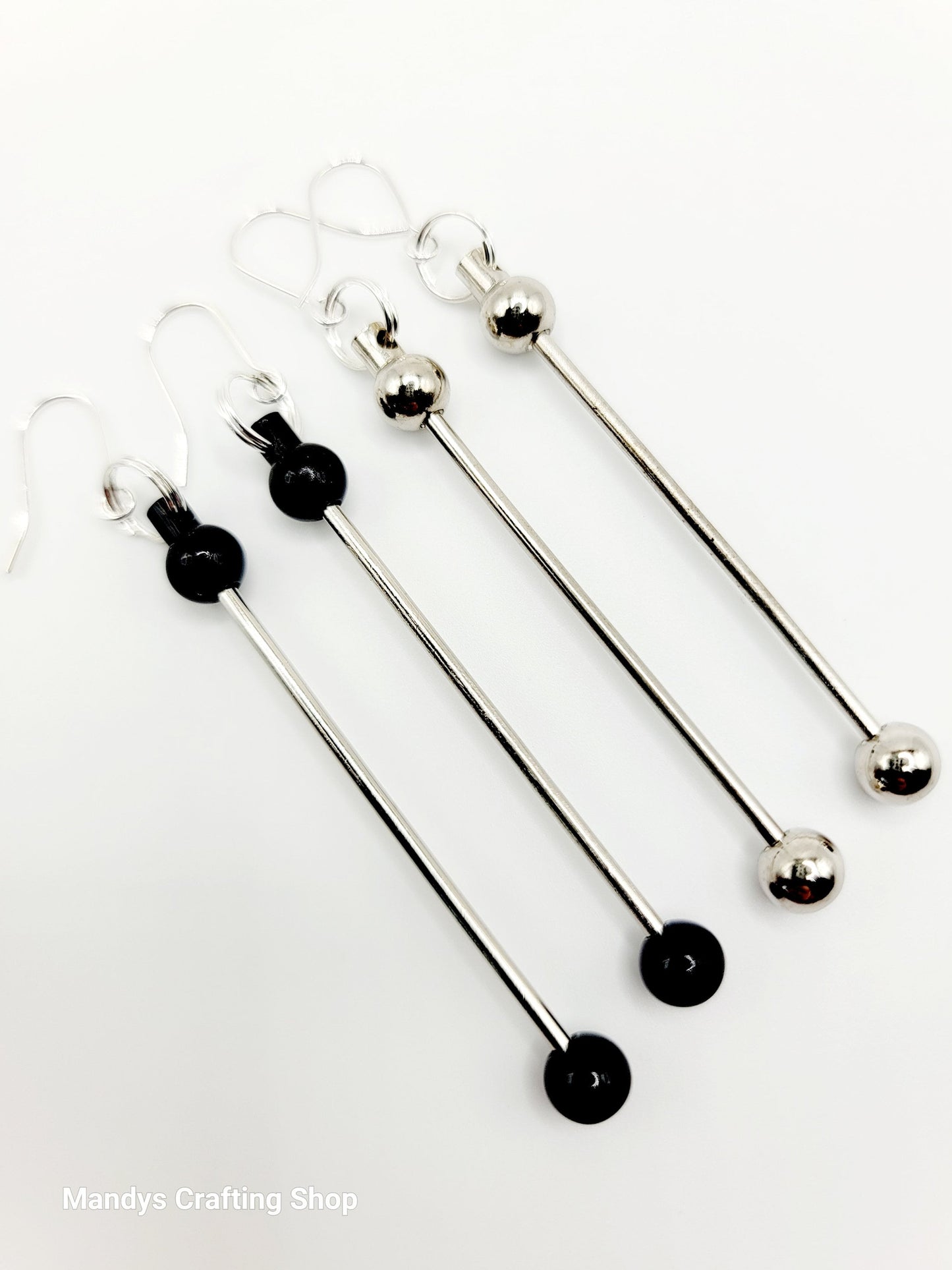 Set of four metal skewers with black ends on a white background, branded 'Mandys Crafting Shop'.