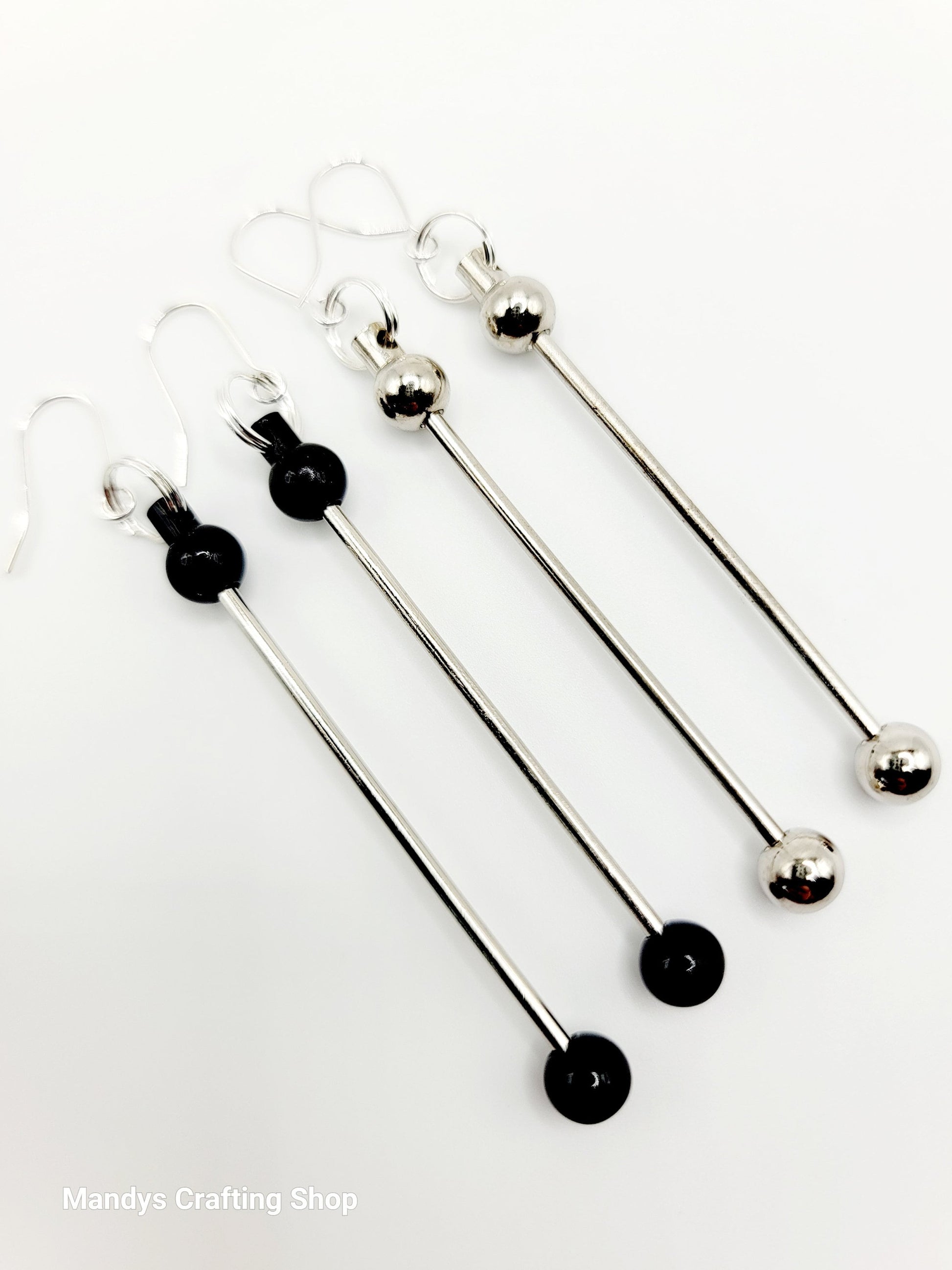 Set of four metal skewers with black ends on a white background, branded 'Mandys Crafting Shop'.