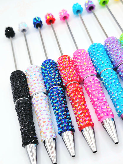 Colorful rhinestone pens on a white background