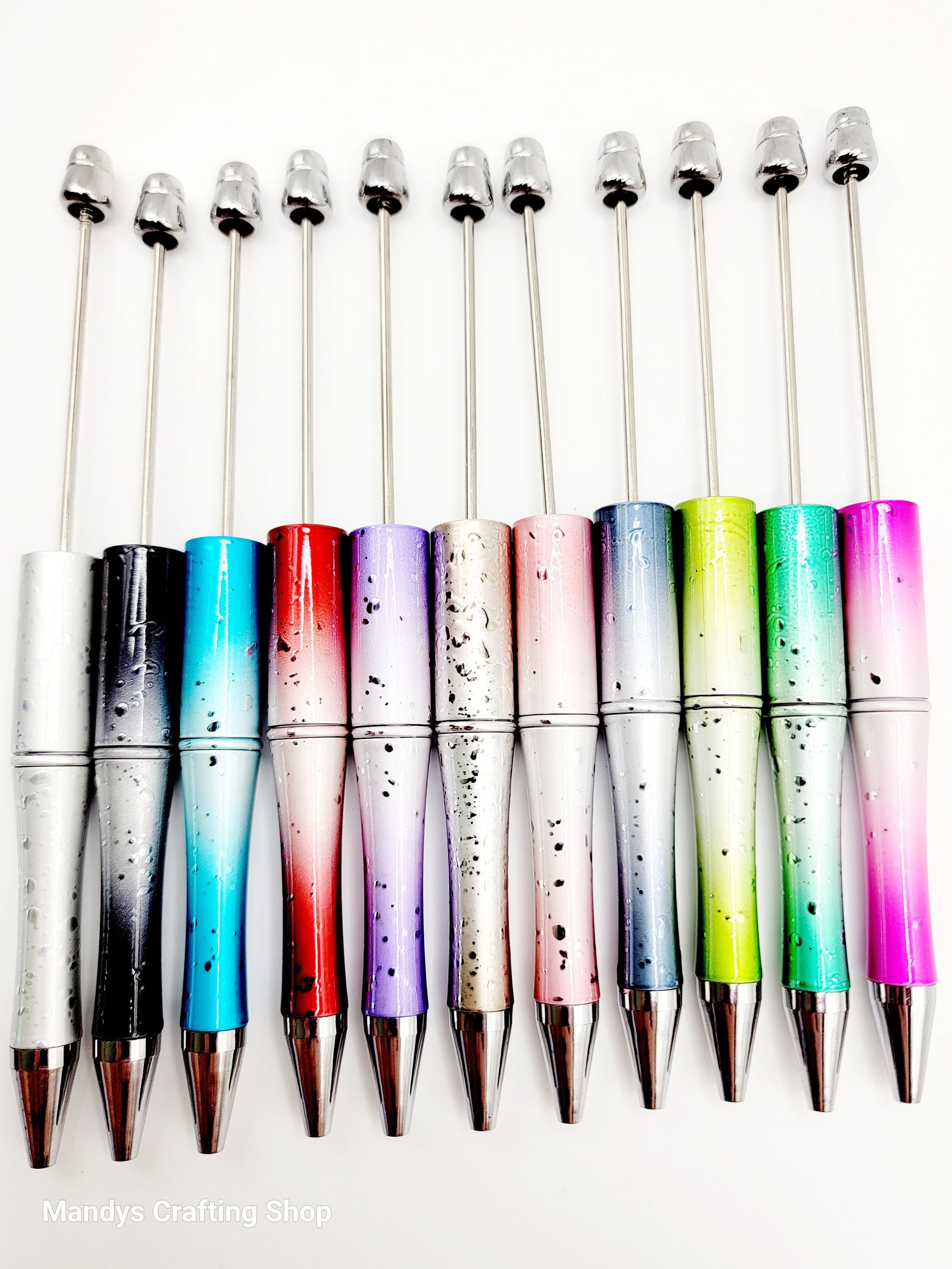 Set of colorful pens with gradient designs on a white background