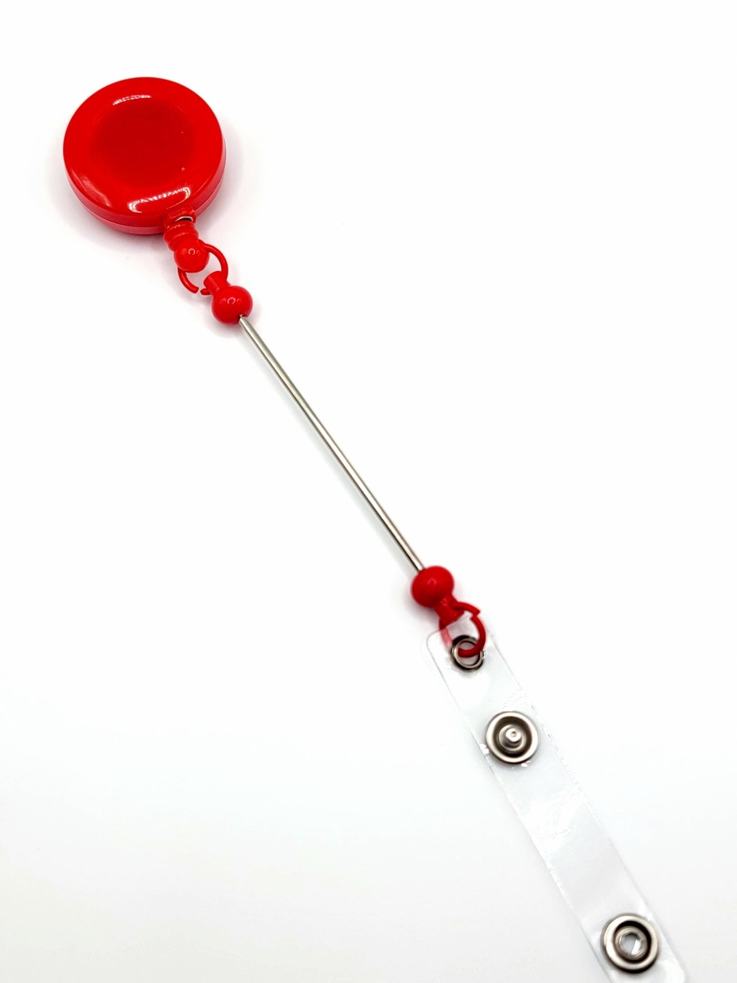 Red badge holder with a retractable strap on a white background