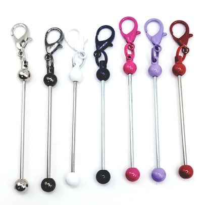 Set of colorful keychain holders with metal hooks on a white background