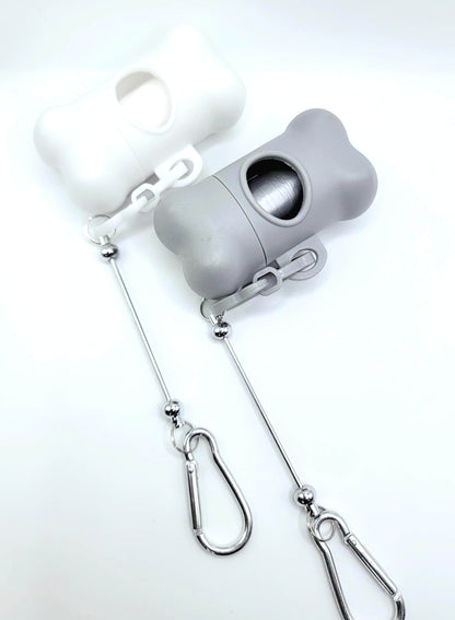 Gray earbud case with a keychain on a white background