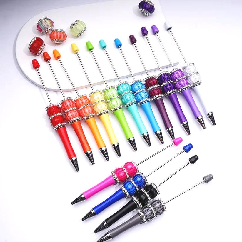 Colorful pen caps and barrels on a white background