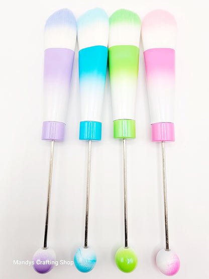 Set of colorful cocktail stirrers with gradient tips on a white background
