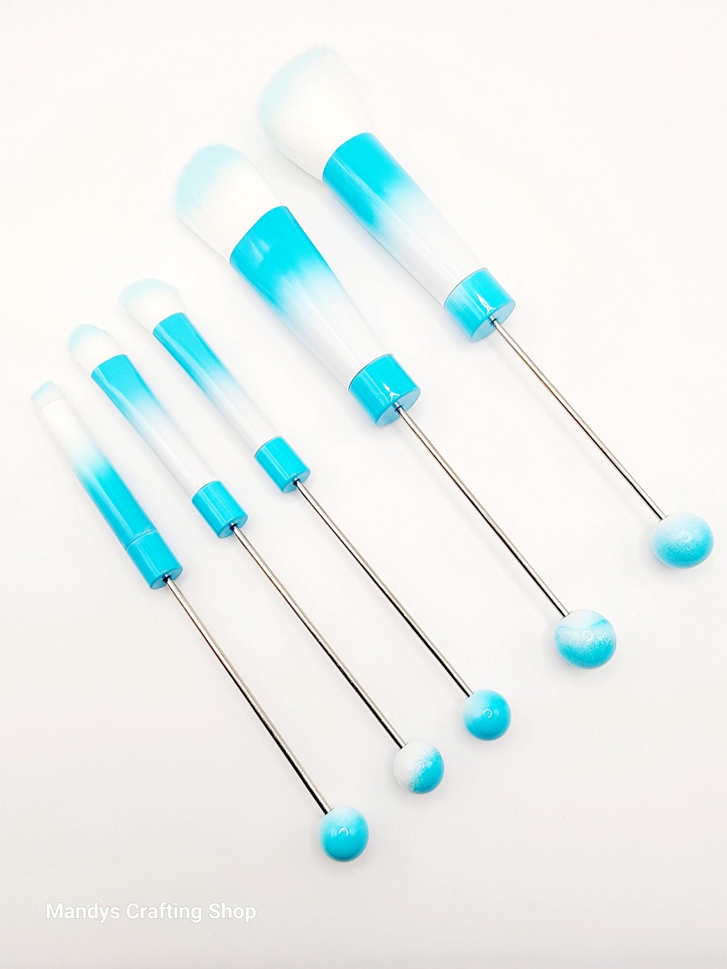 Set of blue and clear plastic needles on a white background