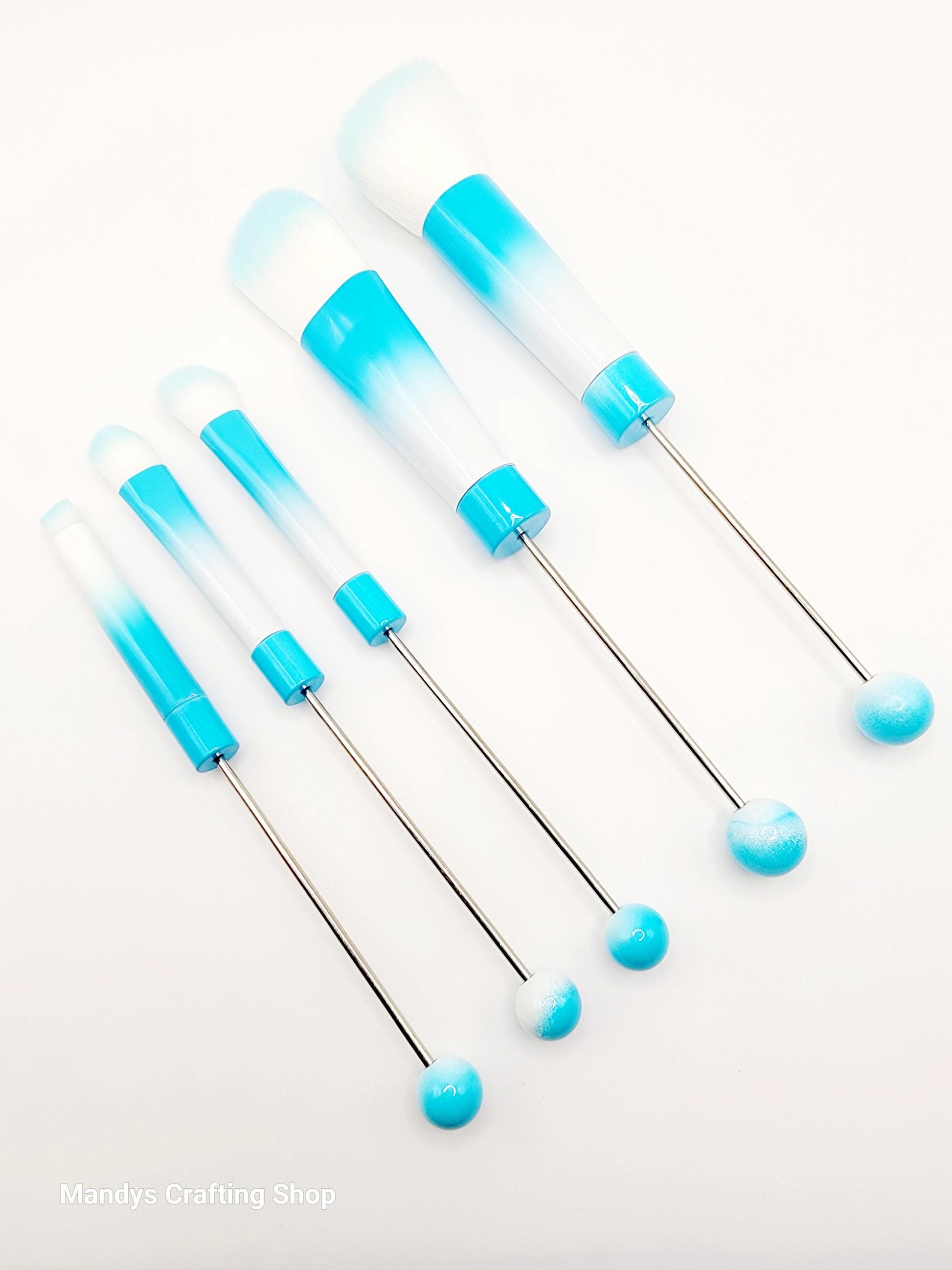 Set of blue and clear plastic needles on a white background