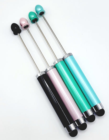 Set of four stylus pens with different colored tips on a white background