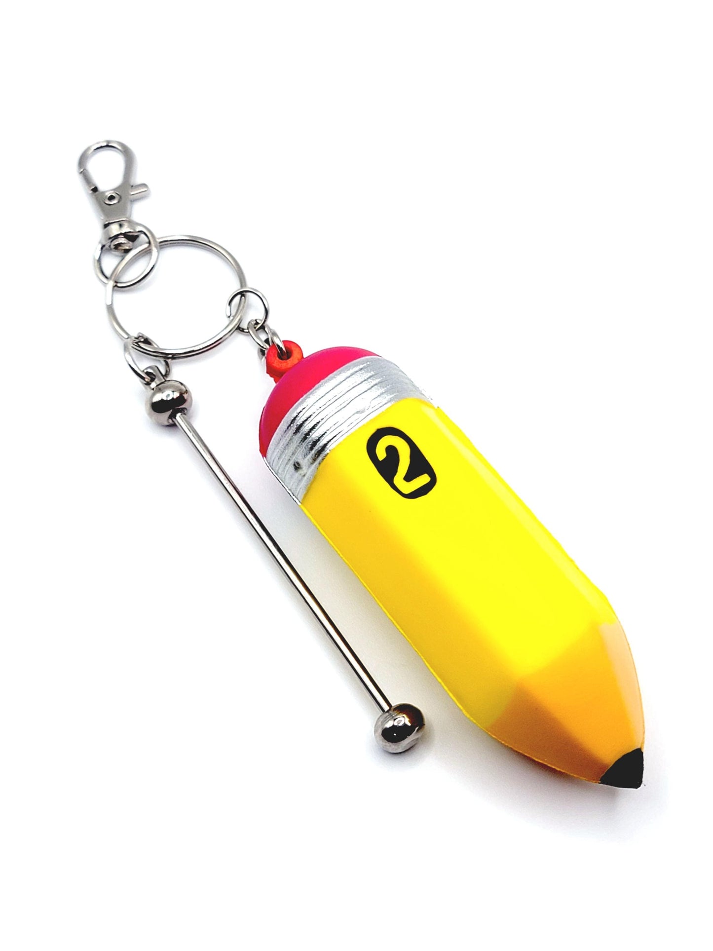 Yellow pencil-shaped keychain with a metal straw on a white background