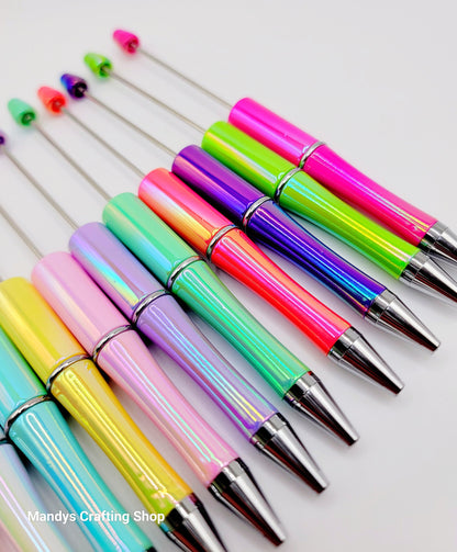 Colorful beadable pens with silver accents on a white background, labeled 'Mandy's Crafting Shop'.