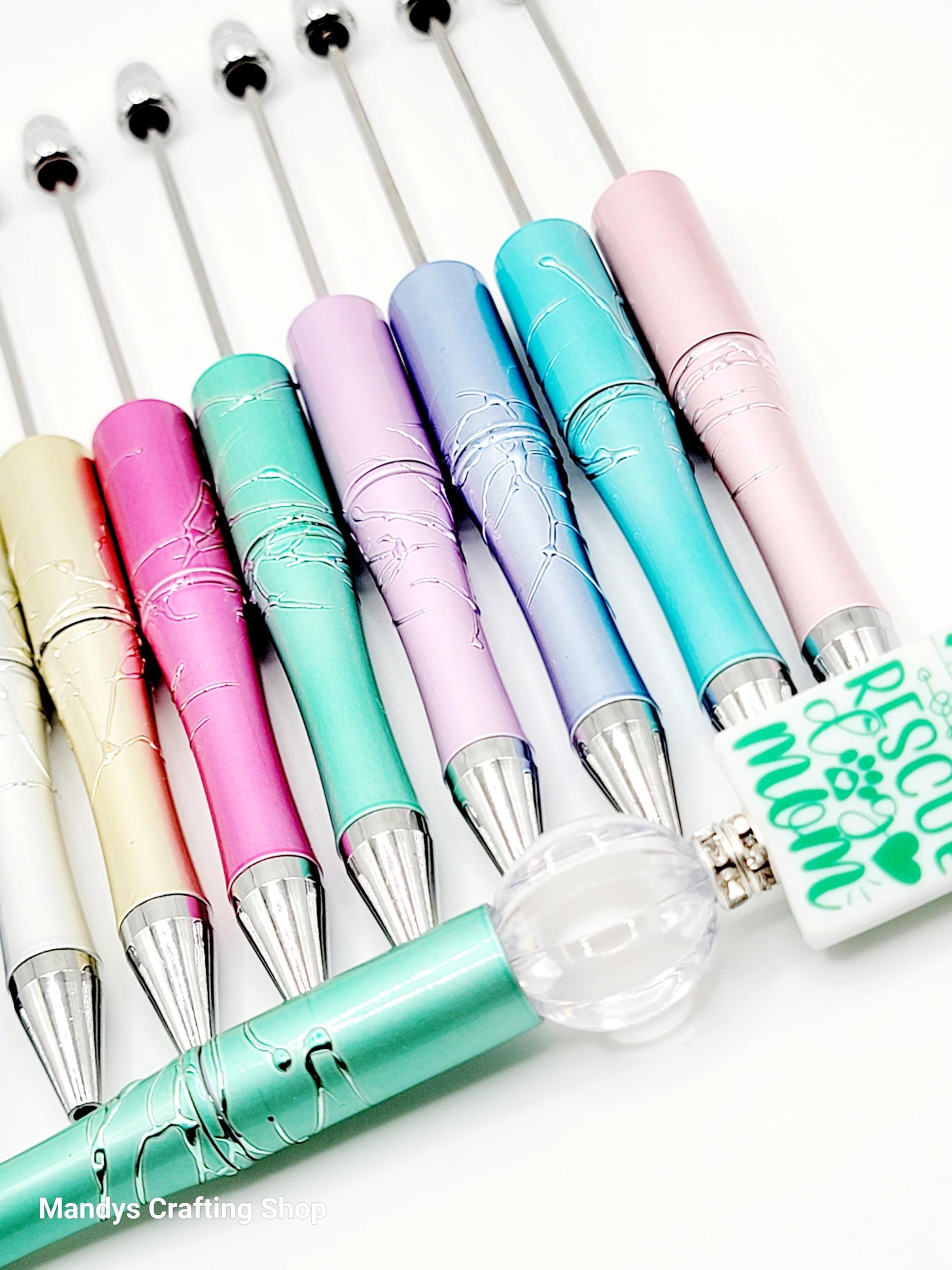 Set of colorful pens with a clear bulb on a white background
