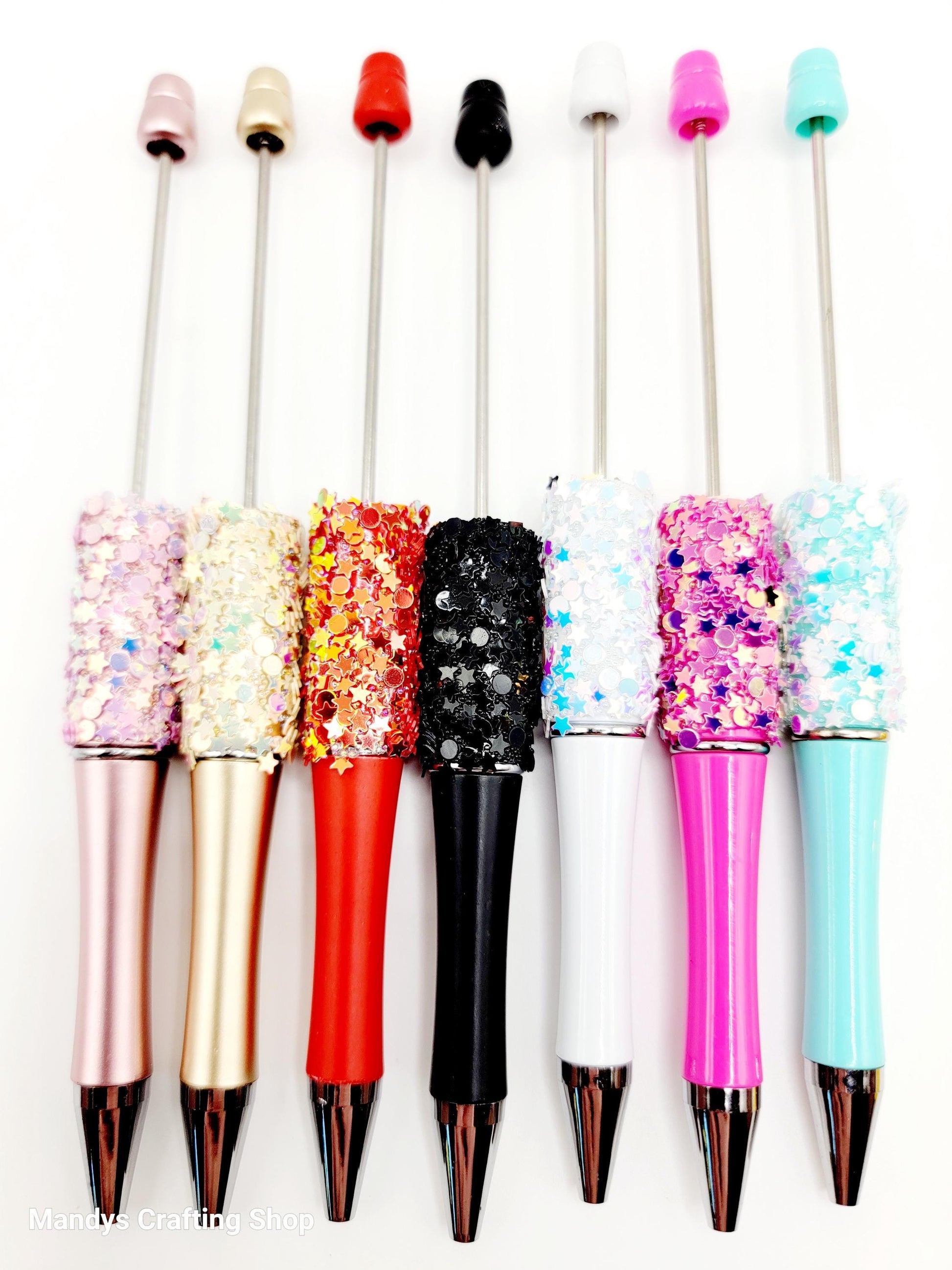 Set of colorful pens with decorative tips on a white background