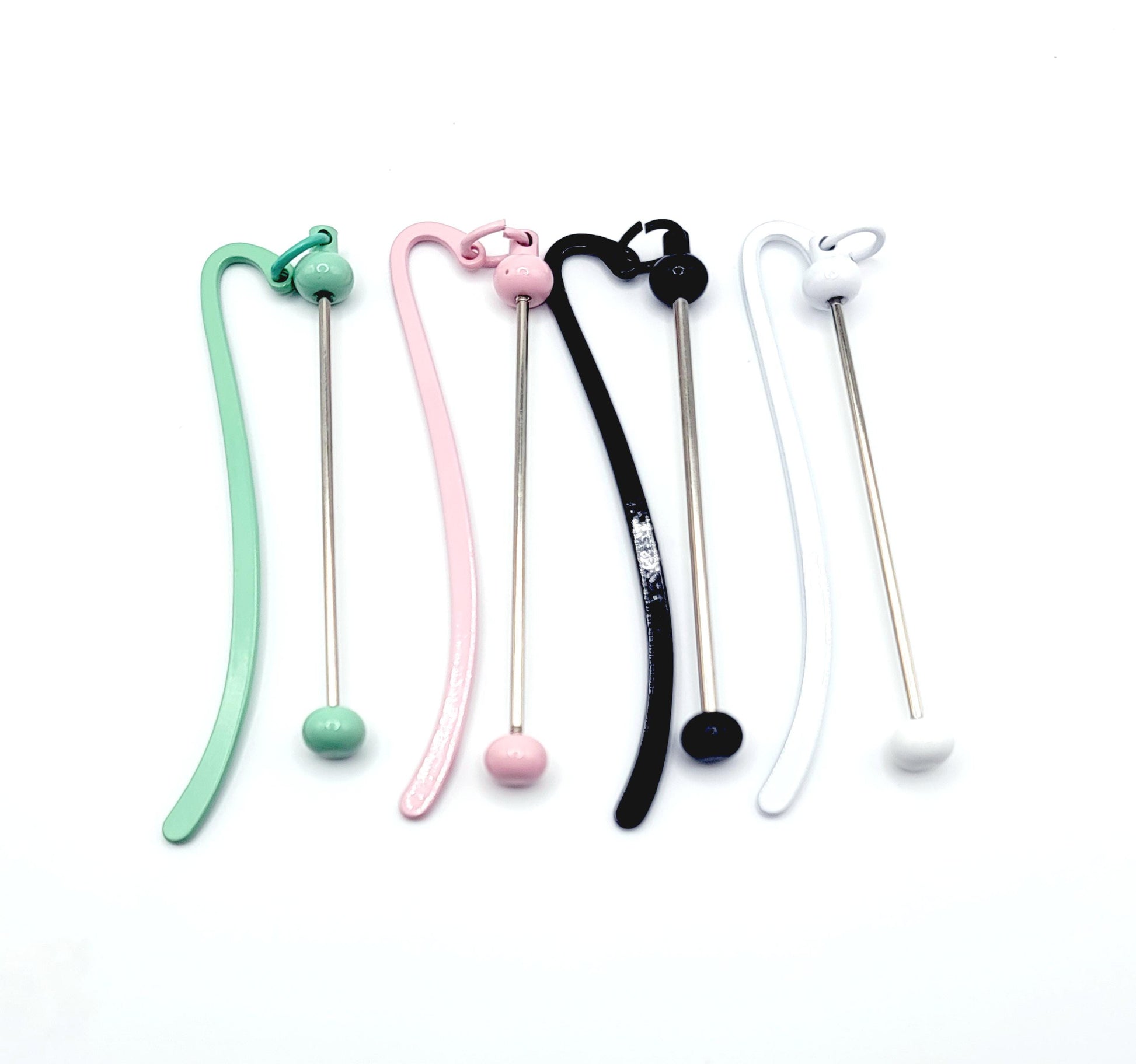 Set of colorful silicone straws with various designs on a white background