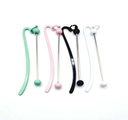 Set of colorful silicone straws with various designs on a white background