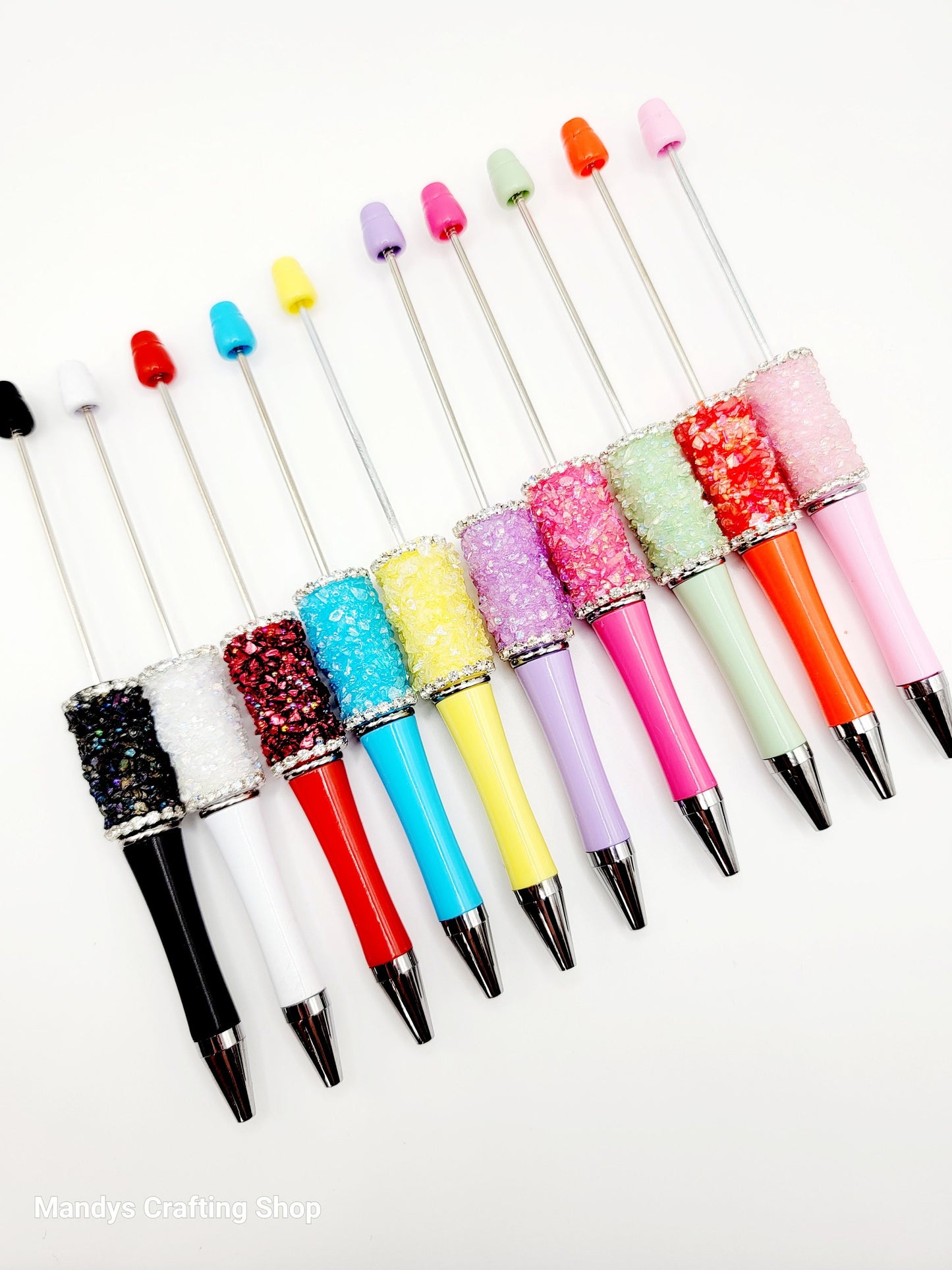 Colorful glittery pen set on a white background