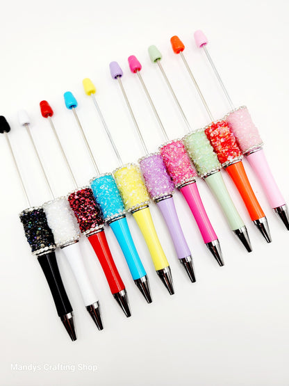Colorful glittery pen set on a white background