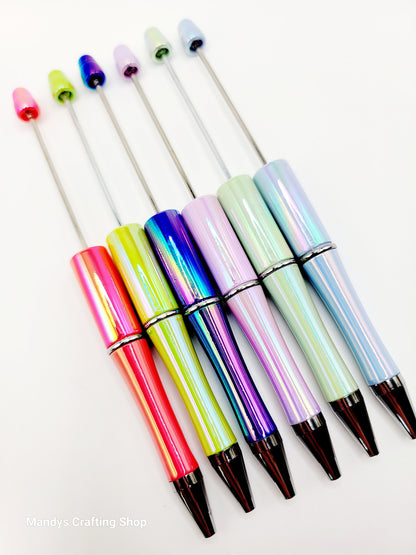Set of colorful pens with multicolored caps on a white background