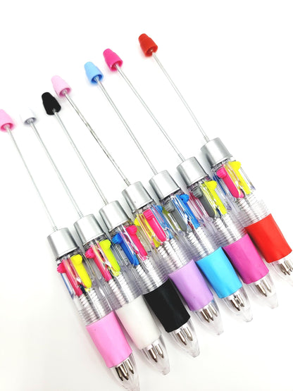 Set of colorful ballpoint pens with transparent bodies on a white background