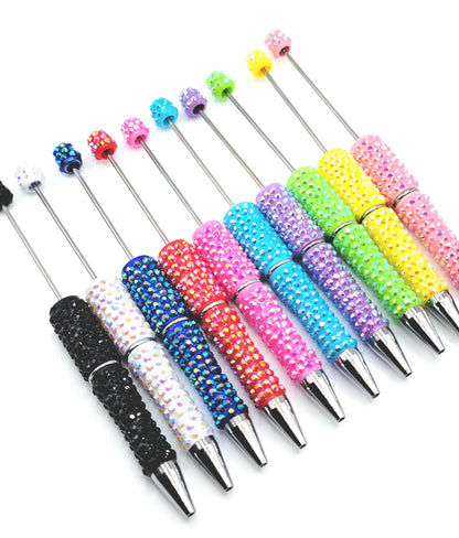 Colorful beaded pen tips on a white background