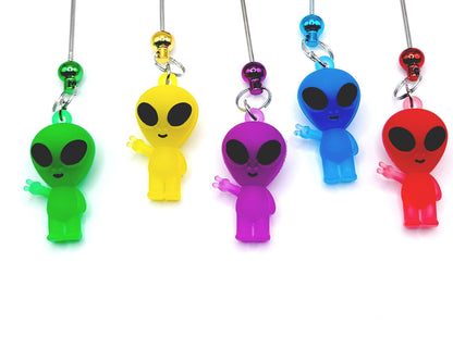 Five colorful alien-shaped phone charms on a white background