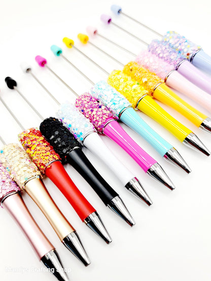 Colorful makeup brushes with decorative handles on a white background