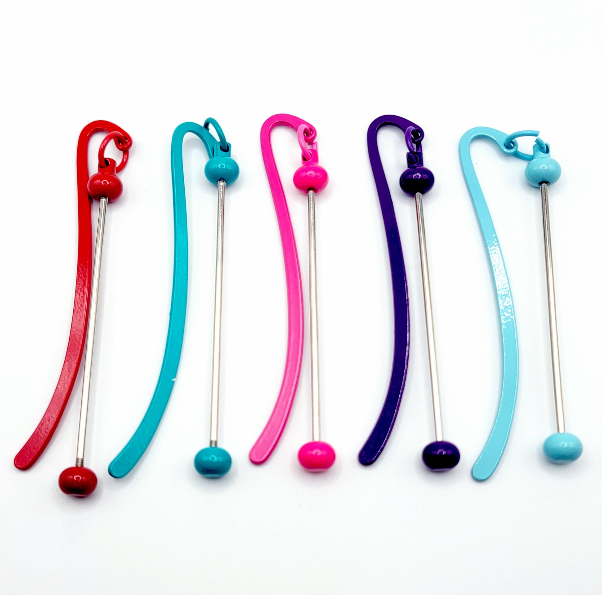 Set of colorful swizzle sticks with different colored ends on a white background