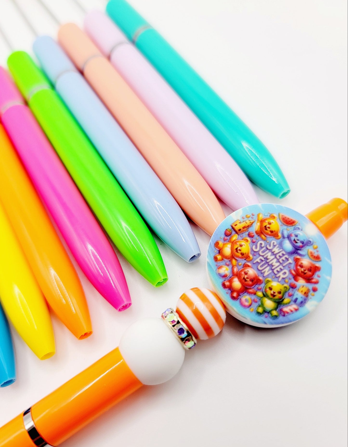 Colorful pens and a decorative pen cap on a white background, with 'Mandys Crafting Shop' branding.