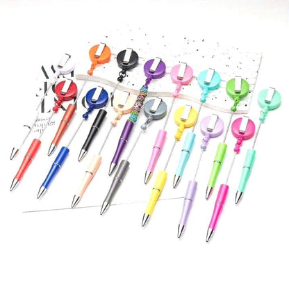Assorted colorful pens with retractable clips on a white background