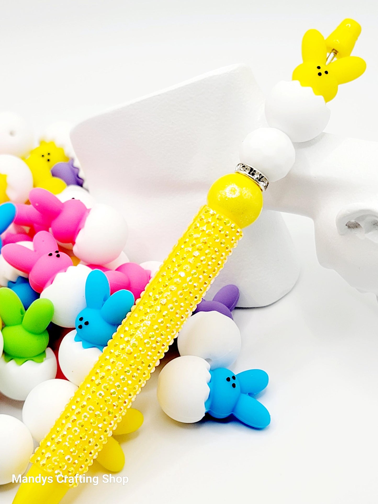 Colorful phone case with glittery yellow design on a white background