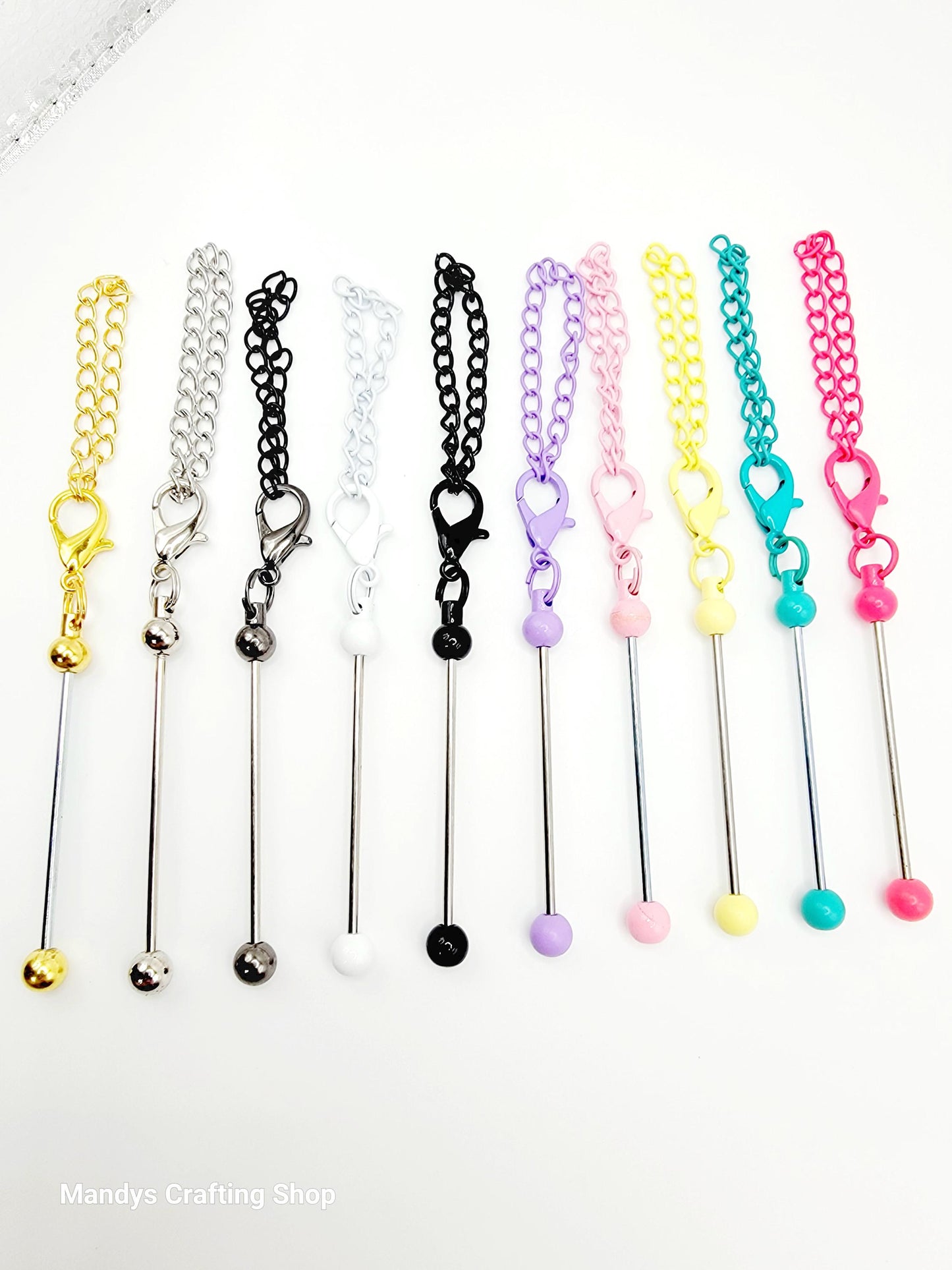 Set of colorful chain extensions with various ends on a white background