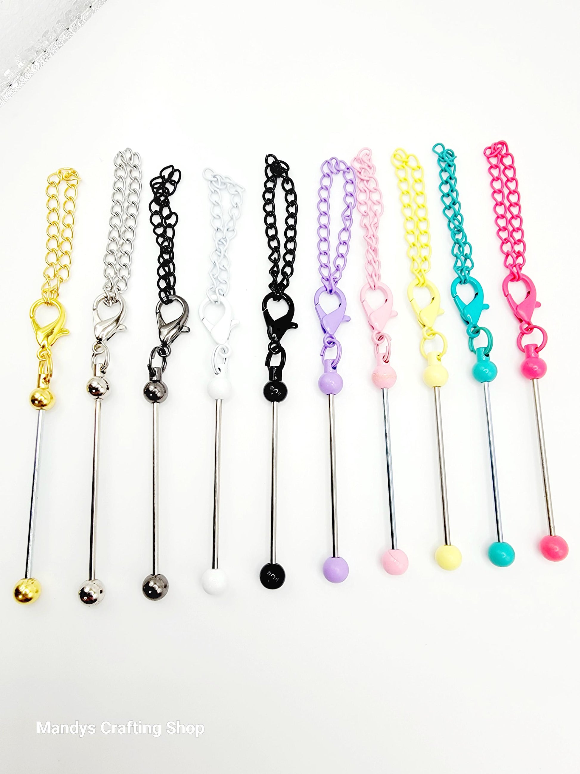 Set of colorful chain extensions with various ends on a white background