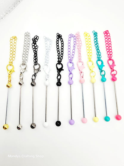 Set of colorful chain extensions with various ends on a white background