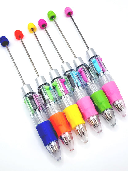 Set of colorful pens with multicolored accents on a white background