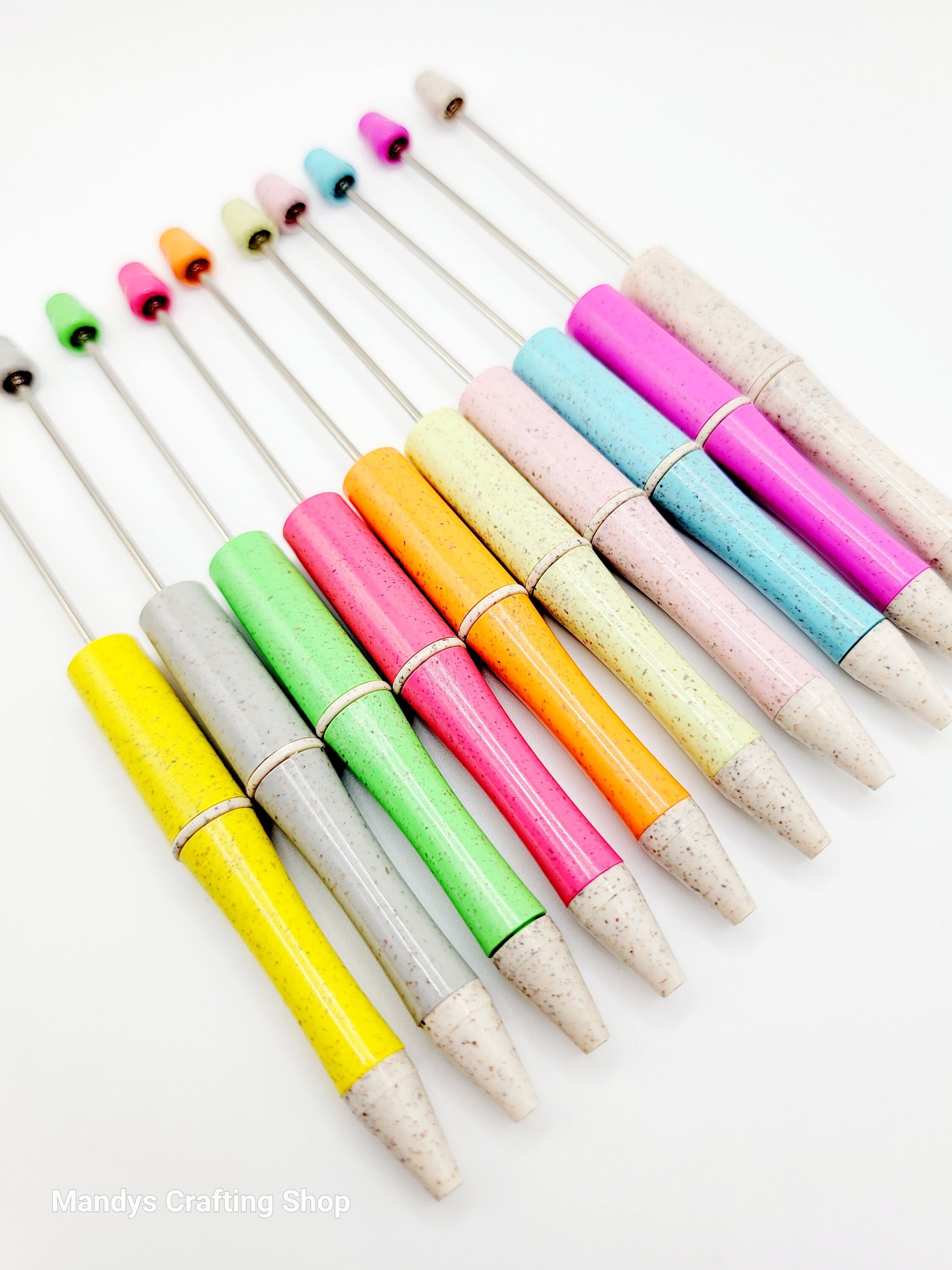 Colorfulpens with wooden tips on a white background