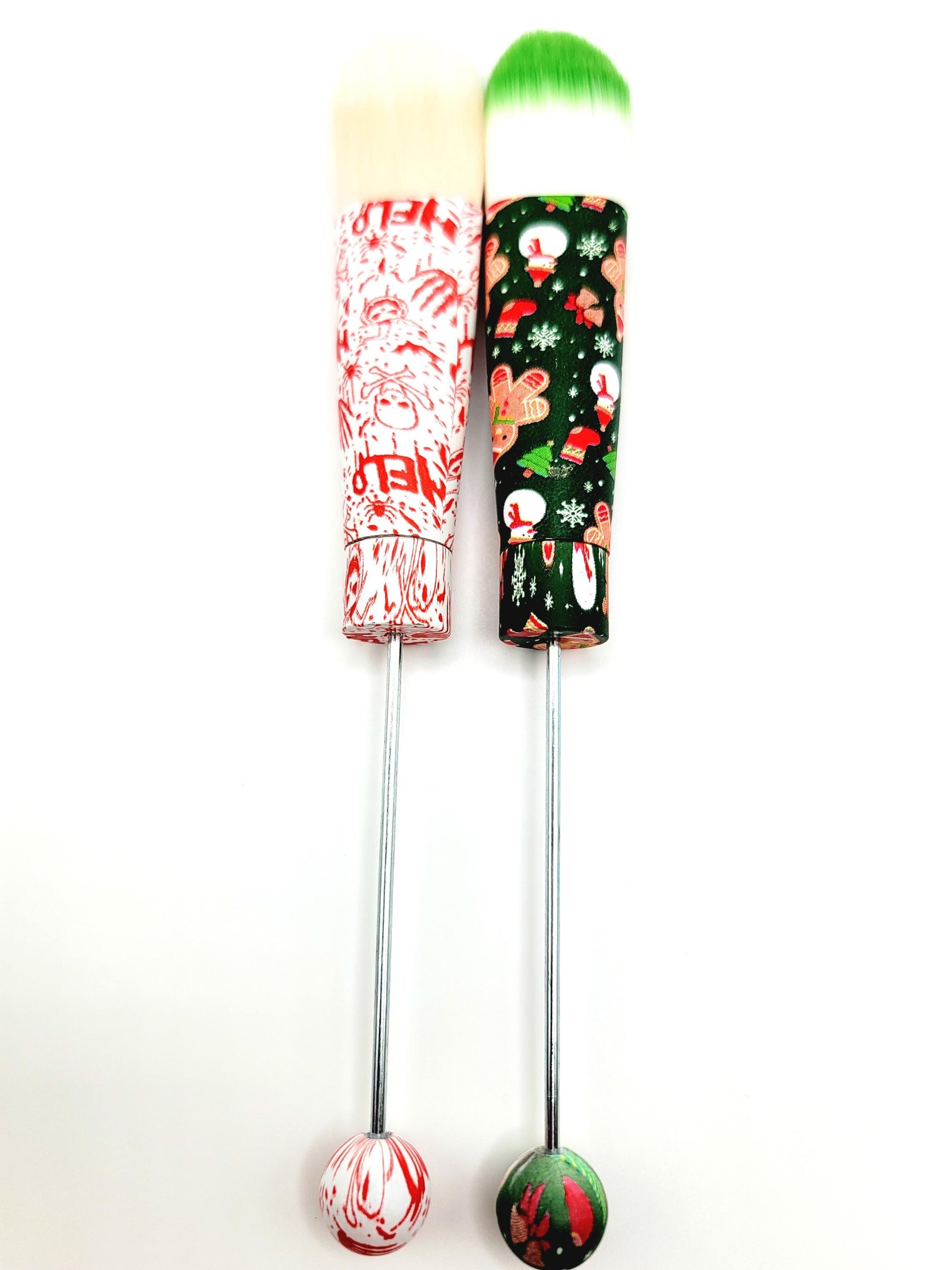 Two colorful cocktail shakers with festive designs on a white background