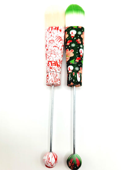 Two colorful cocktail shakers with festive designs on a white background