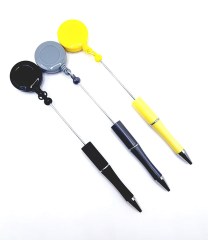 Three retractable pens with different colored accents on a white background